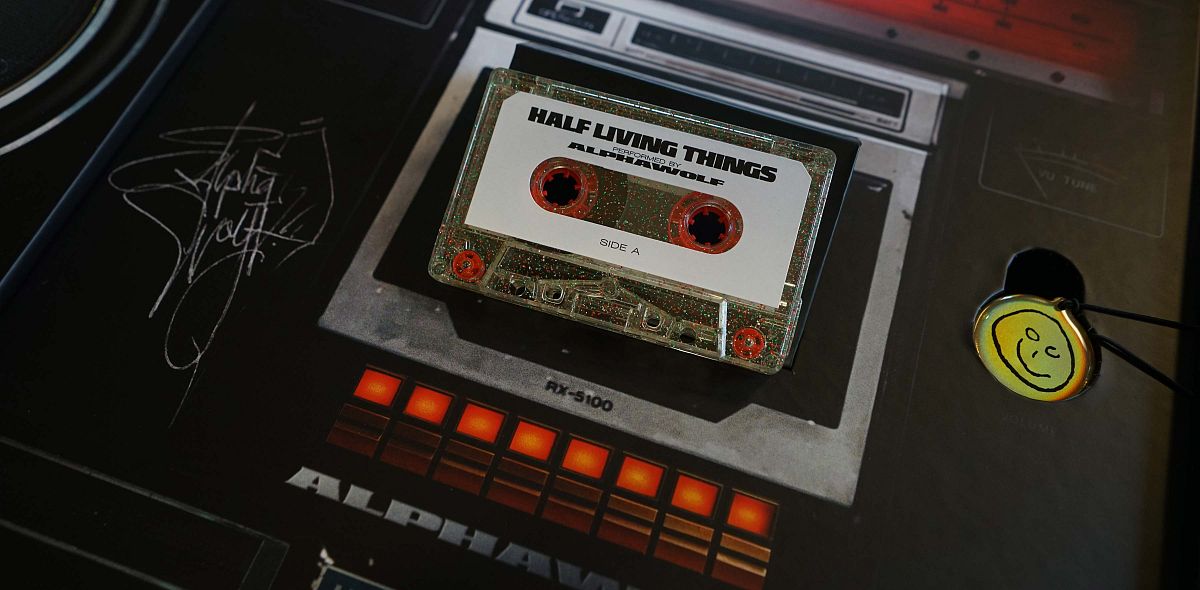 Clear cassette shell with silver, green and red glitter.