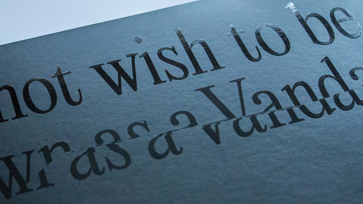 Text picked out with a gloss varnish