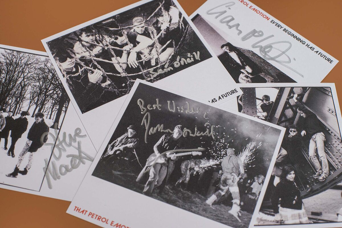 The boxset includes black ad white signed photo reproductions.